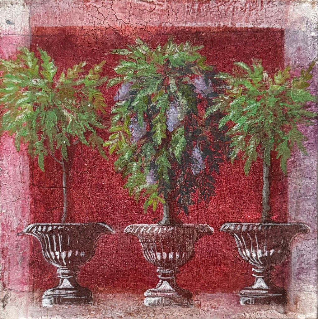 Three flowering trees sprouting from ornate vases. They are framed by a deep terracotta and a lighter red painted frame.
