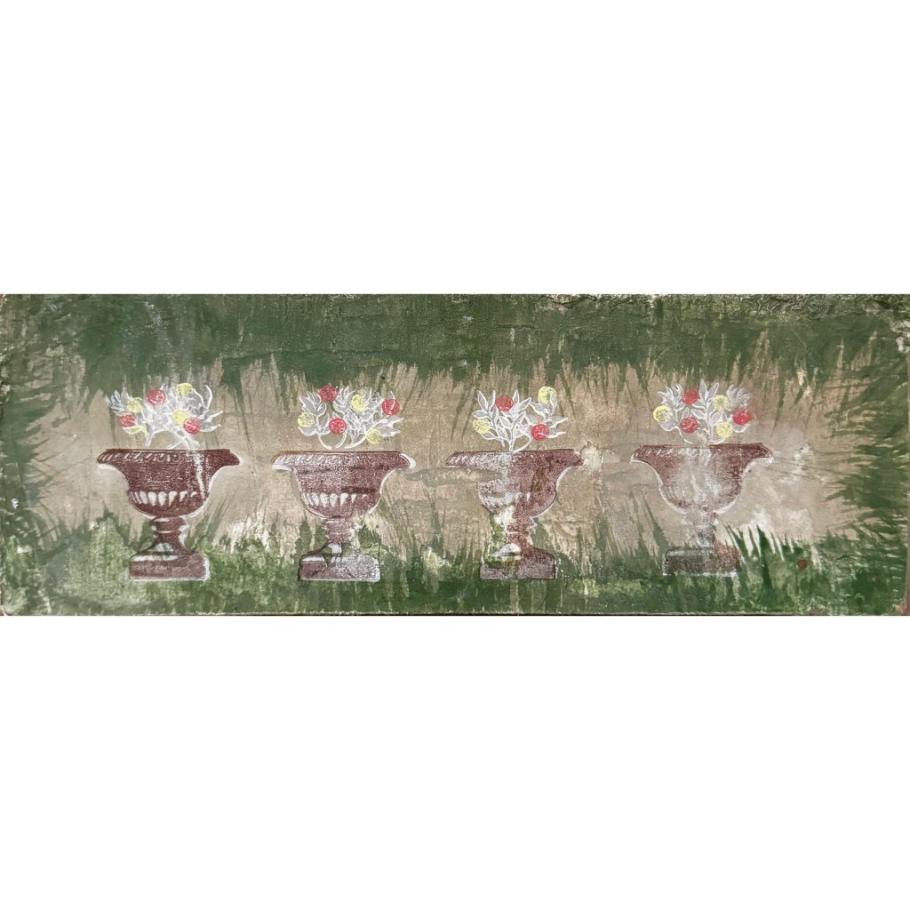 A wide grassy scene featuring abstract grass on all four sides. In the middle is a row of 4 vases with small flower arrangements sprouting from each.